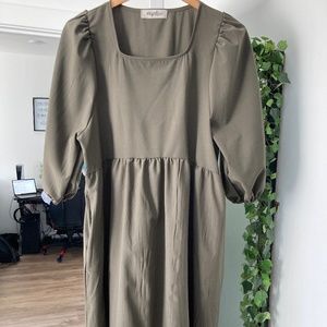Mid- thigh length olive green dress with a square neckline